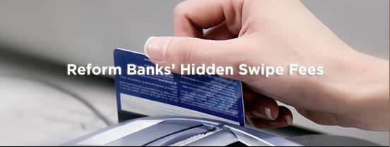 Image of credit card and credit card processor Image of credit card and credit card processor