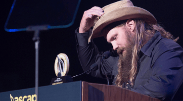 Photo of Chris Stapleton accepting an award at the ASCAP Country Music Awards