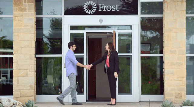 Photo of a Frost Bank employee greeting a customer