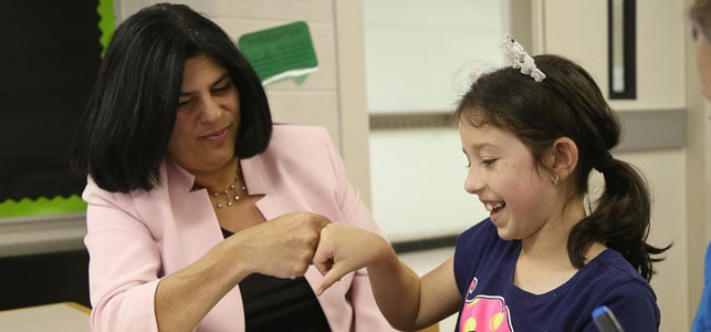 A photo of DFCU Livonia branch manager and a student A photo of DFCU Livonia branch manager and a student