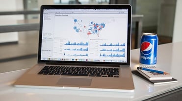 Photo of Tableau on a laptop and a Pepsi Photo of Tableau on a laptop and a Pepsi