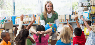 Kids raising their hands in class Kids raising their hands in class