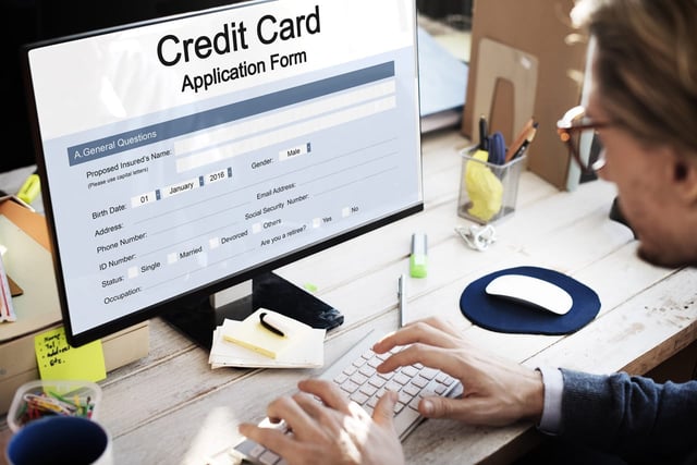Photo of a person applying for a credit card online