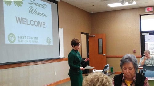 Photo of Judy Long, FirstCNB President and COO, speaking at a Smart Women class in Tennessee Photo of Judy Long, FirstCNB President and COO, speaking at a Smart Women class in Tennessee