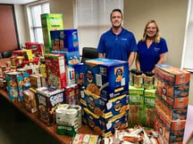 Brandon Favro and Jeannie Straub from Jersey Shore FCU's Social Action Committee pictured at the 2018 Kid-Friendly Food Drive