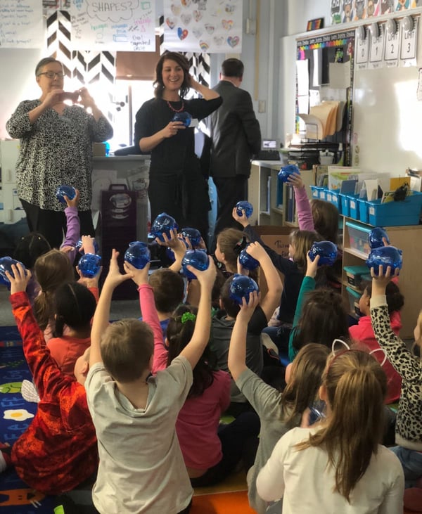 Photo of a ChoiceOne employee hosting a financial literacy lesson at a local school