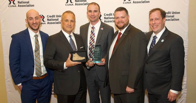 Photo of EICU management being presented with CUNA award
