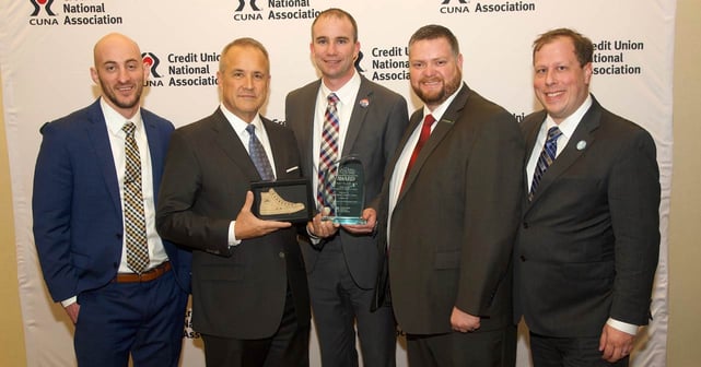 Photo of EICU management being presented with CUNA award Photo of EICU management being presented with CUNA award