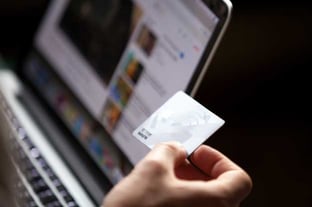 Hand Holding a Debit Card Hand Holding a Debit Card