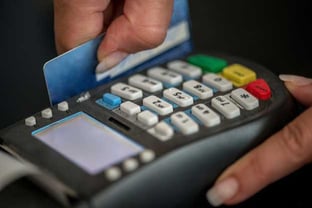 Hand Swiping Credit Card