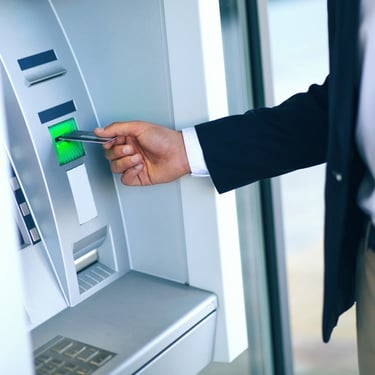 Photo of a Man at an ATM Machine