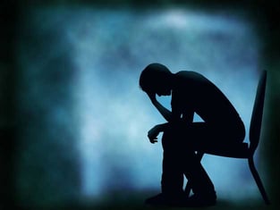 Silhouette of a Depressed Person Silhouette of a Depressed Person
