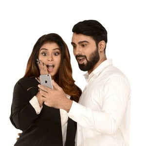 Man and Woman Looking at Smartphone Man and Woman Looking at Smartphone