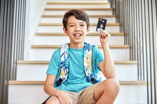 Child Holding a Greenlight Card
