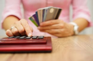 Woman Calculating Credit Card Debt Woman Calculating Credit Card Debt