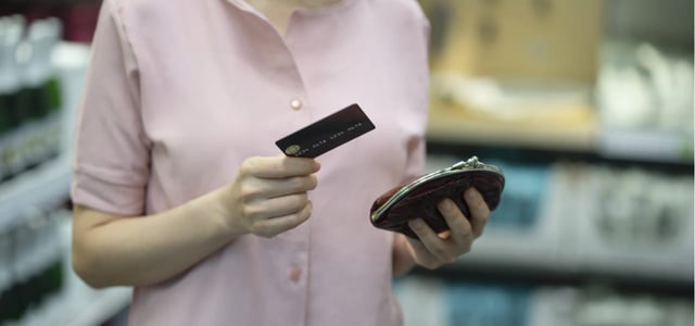 Picture of a woman holding a credit card Picture of a woman holding a credit card