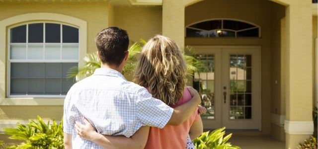 Couple looking at a house.