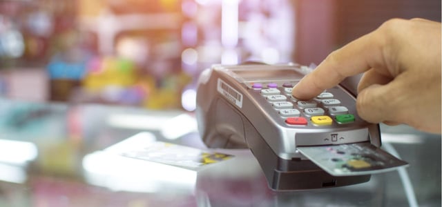 Person using a credit card reader. Person using a credit card reader.