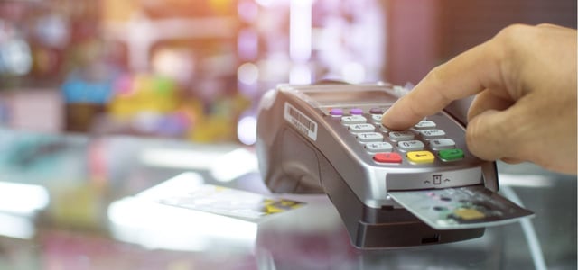 Person using a credit card reader.