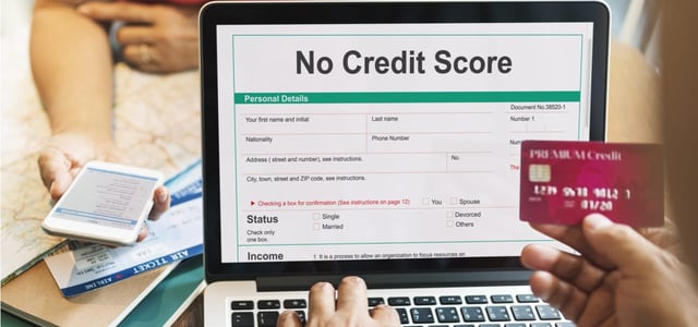 A laptop and a credit card. A laptop and a credit card.