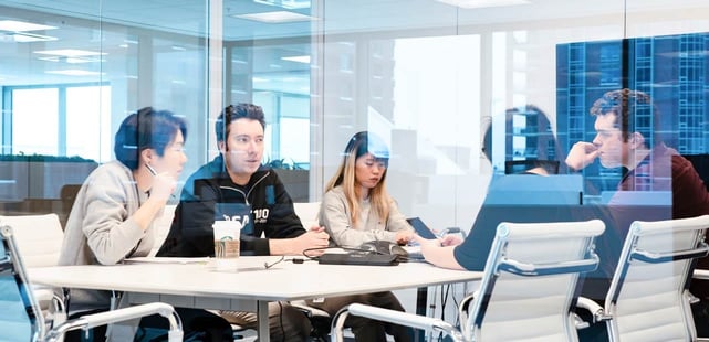 Photo of Helcim team members at a conference table Photo of Helcim team members at a conference table