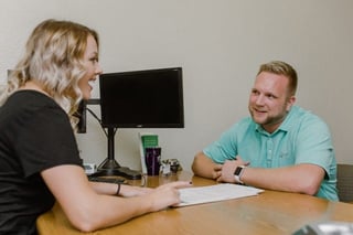 Photo of Dakota Community Bank & Trust team member with customer