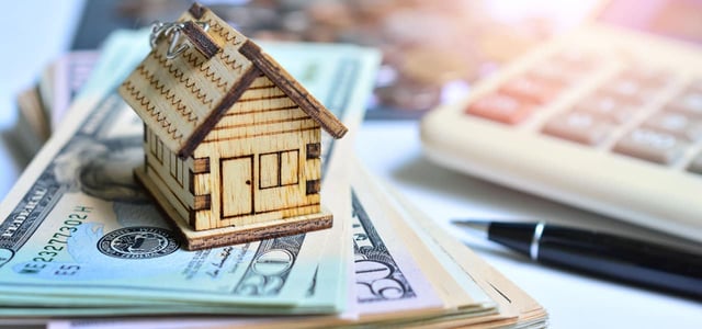 house model on money, home loan concept