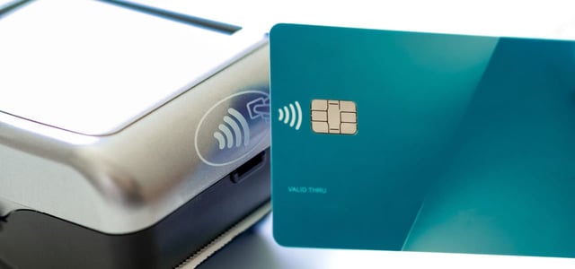 Credit Card and Card Reader Showing the Contactless Symbol Credit Card and Card Reader Showing the Contactless Symbol
