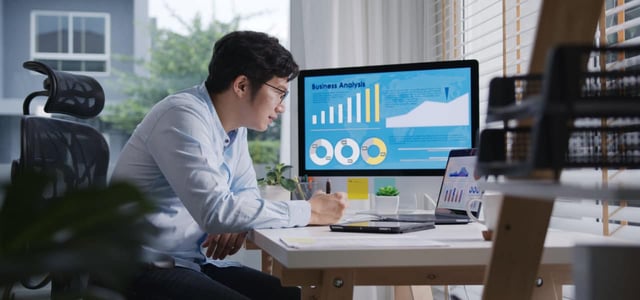 Man analyzing business data on a computer