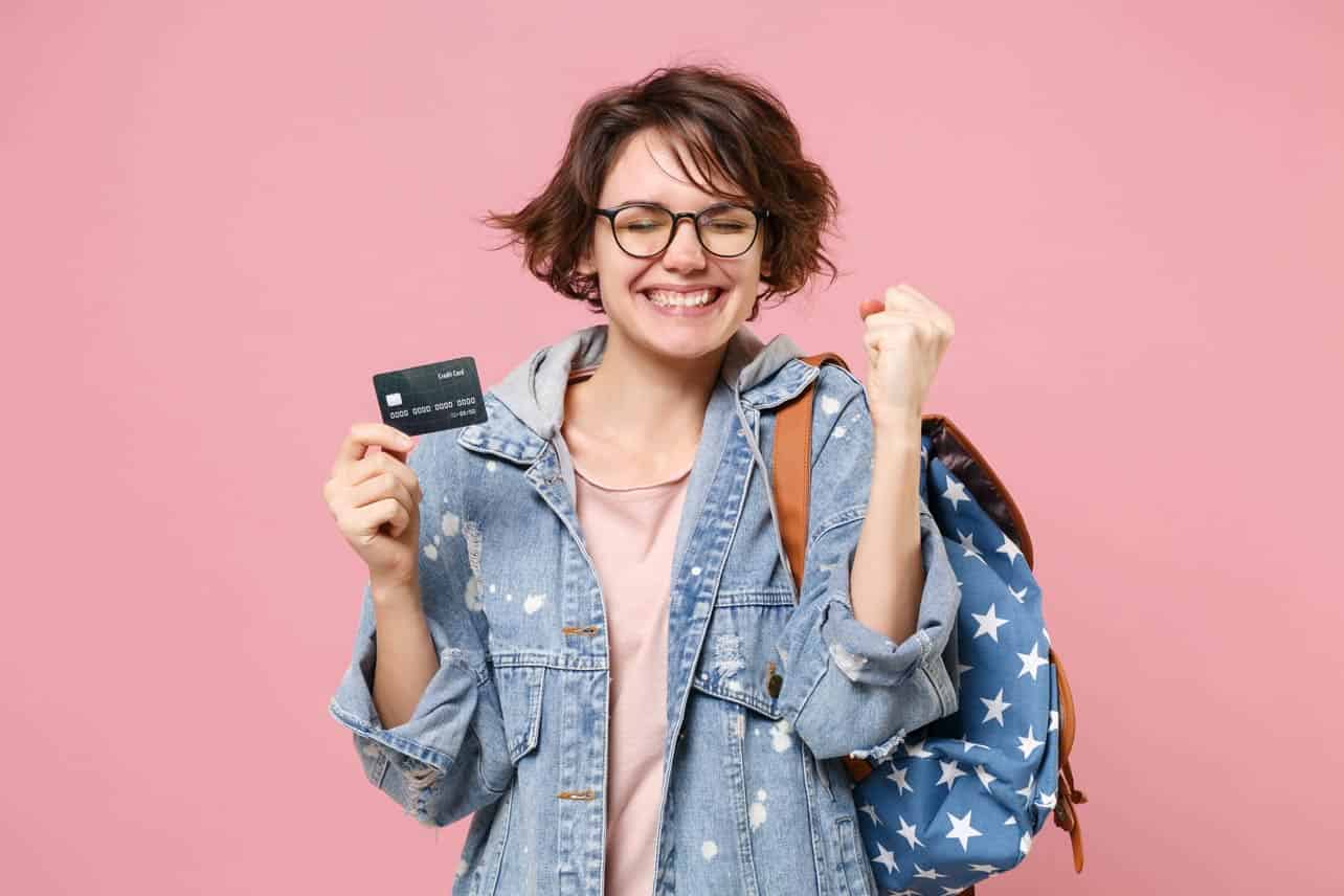 Photo of young student with a credit card