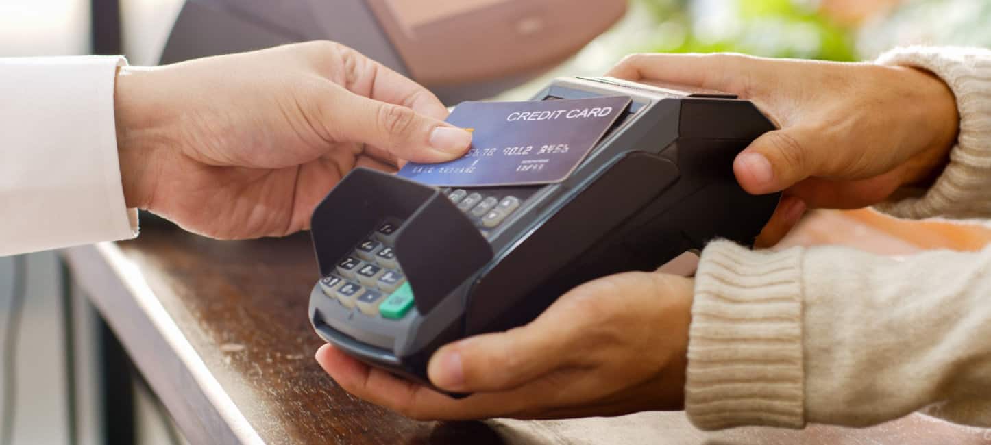 Customer using credit card reader for payment, cashless technology and credit card payment concept