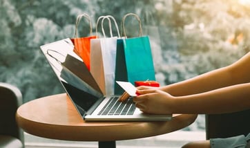 shopper with card, laptop, shopping bags shopper with card, laptop, shopping bags
