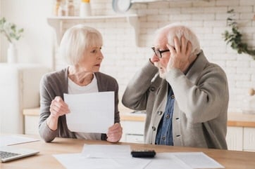 Photo of Senior Couple Stressing Over Bills Photo of Senior Couple Stressing Over Bills