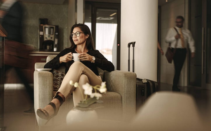 a woman in an airport lounge graphic
