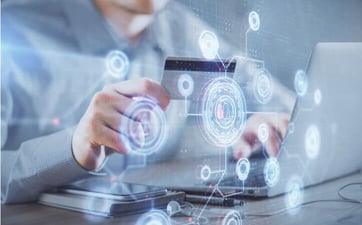 a man holding a credit card in front of laptop graphic a man holding a credit card in front of laptop graphic