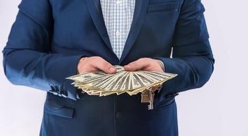 person holding cash person holding cash
