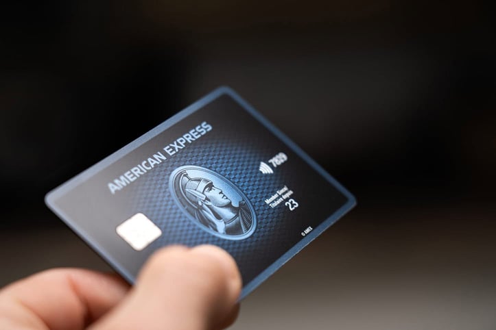 Amex card in hand Amex card in hand