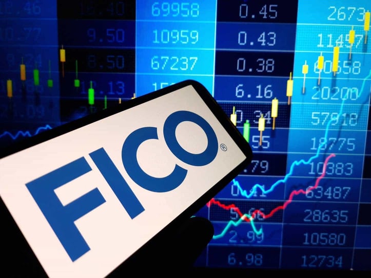FICO on phone in front of data FICO on phone in front of data
