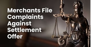 Merchants File Complaints Against Settlement Offer