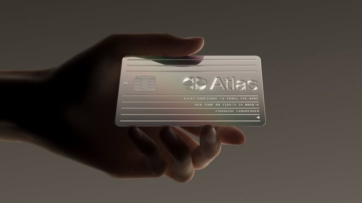 Hand holding Atlas card