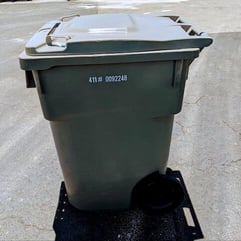 Photo of trash bin filled with papers to be shredded Photo of trash bin filled with papers to be shredded